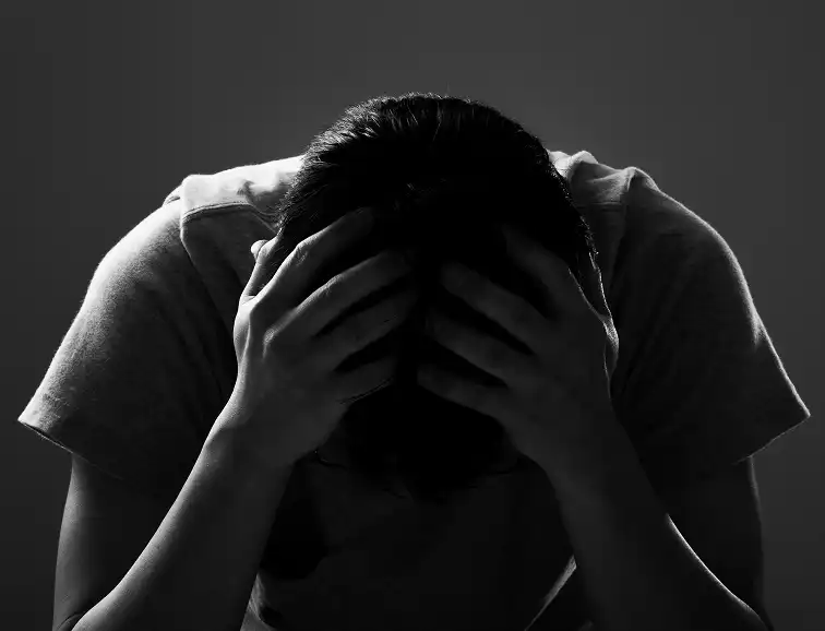 A person feeling overwhelmed by anxiety